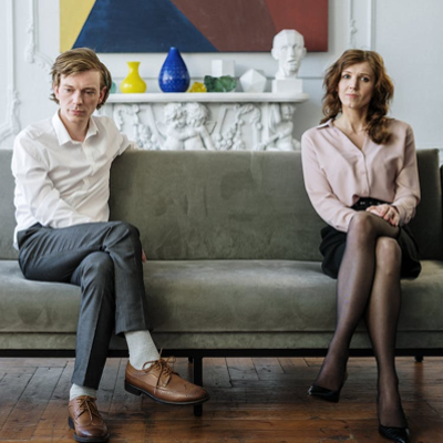 a couple upset with eachother on a couch