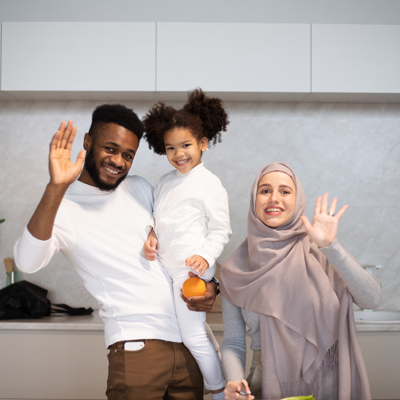 a mother and father with their daughter